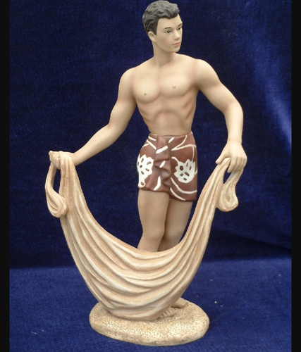 Vintage porcelain figure of young Hawaiian man with net